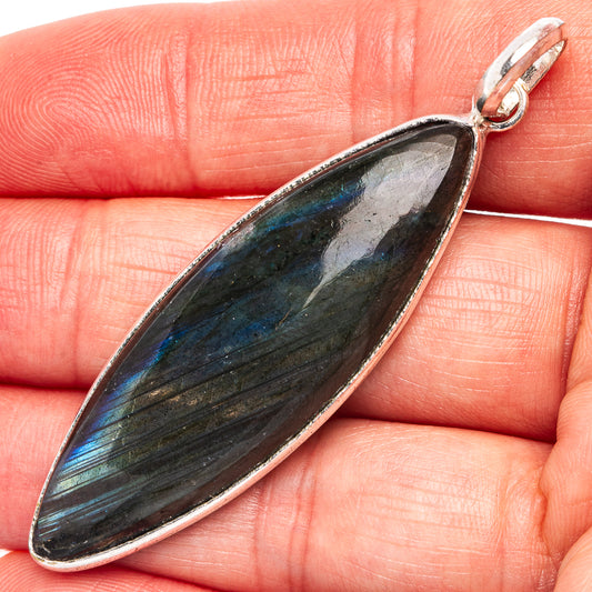 Silver-plated labradorite marquise pendant with dark gray and blue-green shimmer.