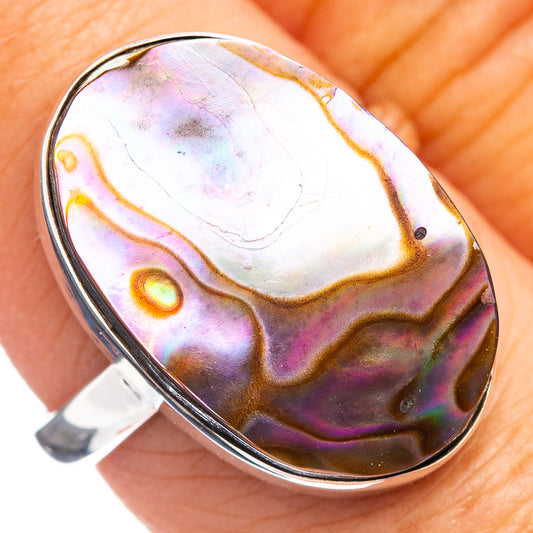 Abalone shell ring in oval sterling silver setting, size 8; iridescent purple, green, orange.