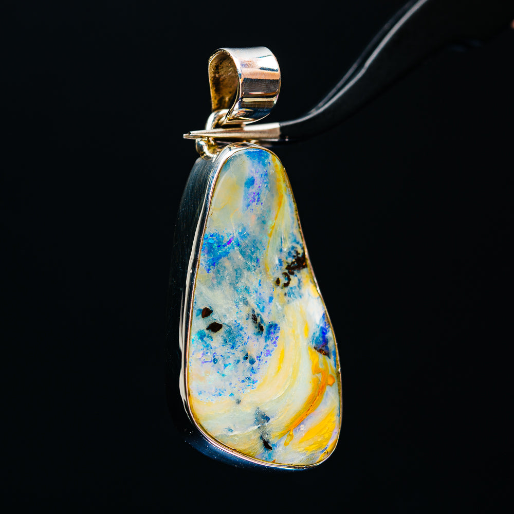 Sterling silver teardrop boulder opal pendant, blue and yellow stone with loop bail