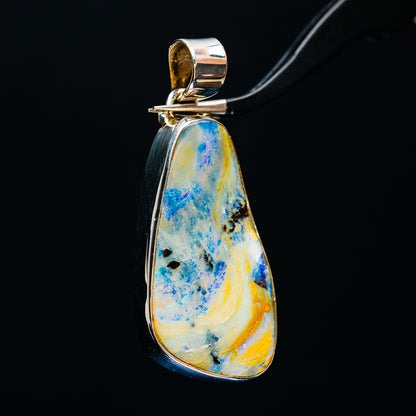 Sterling silver teardrop boulder opal pendant, blue and yellow stone with loop bail