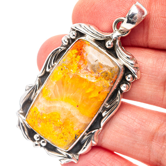 Sterling silver bumblebee jasper pendant with rectangular amber-orange stone and ornate frame