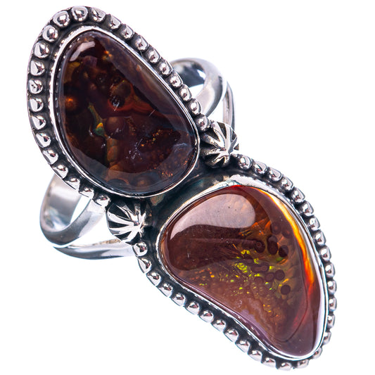 Sterling silver ring with two oval fire agate stones, beaded bezel, starburst detail.