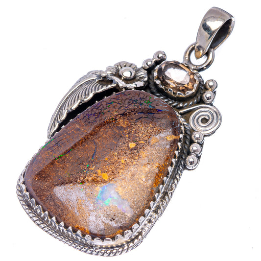 Sterling silver boulder opal pendant, teardrop bezel with rainbow color play in brown stone