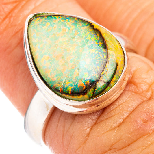 Sterling silver opal ring with pear-shaped green and orange stone