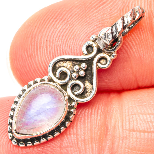 Oval rainbow moonstone pendant in .925 sterling silver filigree, with ornate bail
