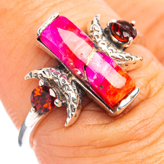 Sterling silver ring with pink rectangular stone and red round accents, ornate settings