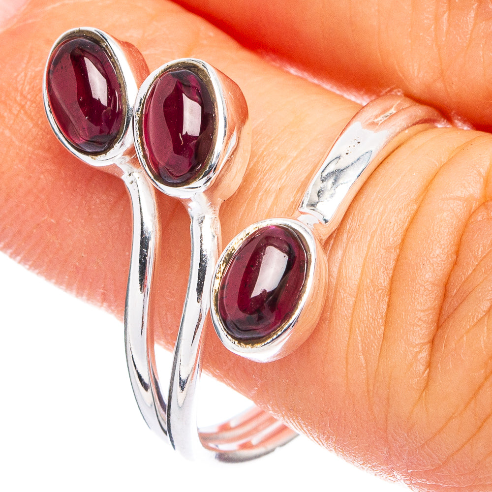 Dainty sterling silver ring with three oval deep red garnets, size 7.25