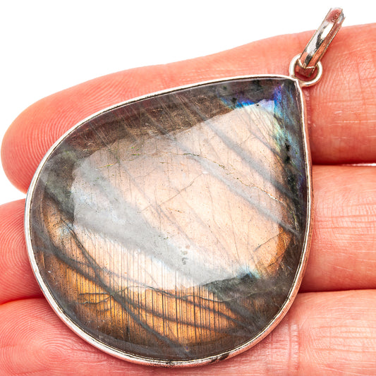 Labradorite teardrop pendant with silver-plated edge and loop bail, blue-gold flash