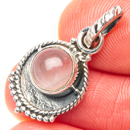 Oval rose quartz pendant with .925 sterling silver beaded border and scalloped bezel