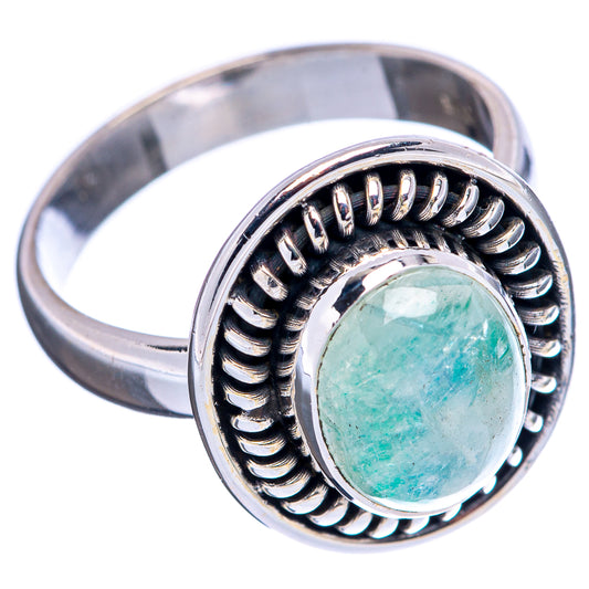 Oval green moonstone ring in 925 sterling silver with decorative scalloped setting, side view