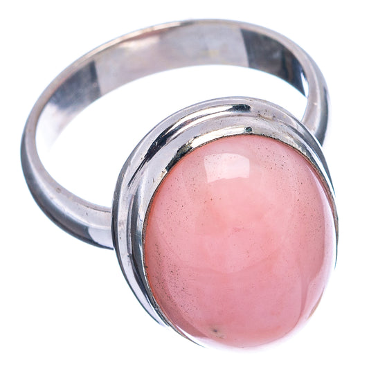Oval pink opal set in .925 sterling silver ring band, size 6