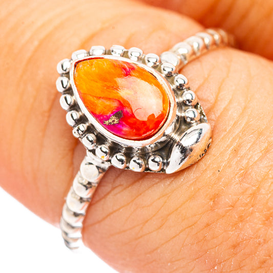 Teardrop orange gemstone sterling silver ring with raised bead-like halo setting