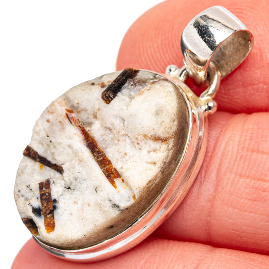 Astrophyllite pendant in 925 sterling silver, oval cabochon with dark veining.