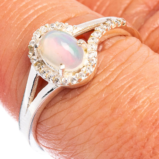 Sterling silver oval gemstone ring with prong-set opal look and sparkling CZ accents