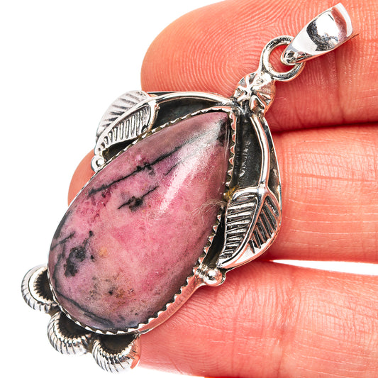Rhodonite teardrop pendant in .925 sterling silver bezel with ornate side detailing