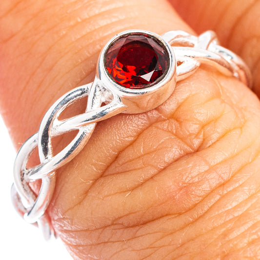 Sterling silver dainty ring with round bezel-set red garnet on finger, size 7.75