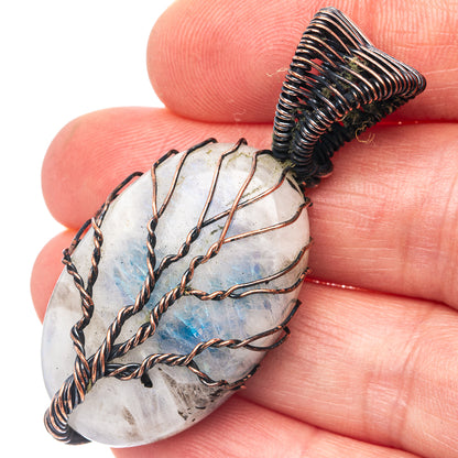 Oxidized copper wire-wrapped moonstone-style pendant with tree-of-life motif, oval shape