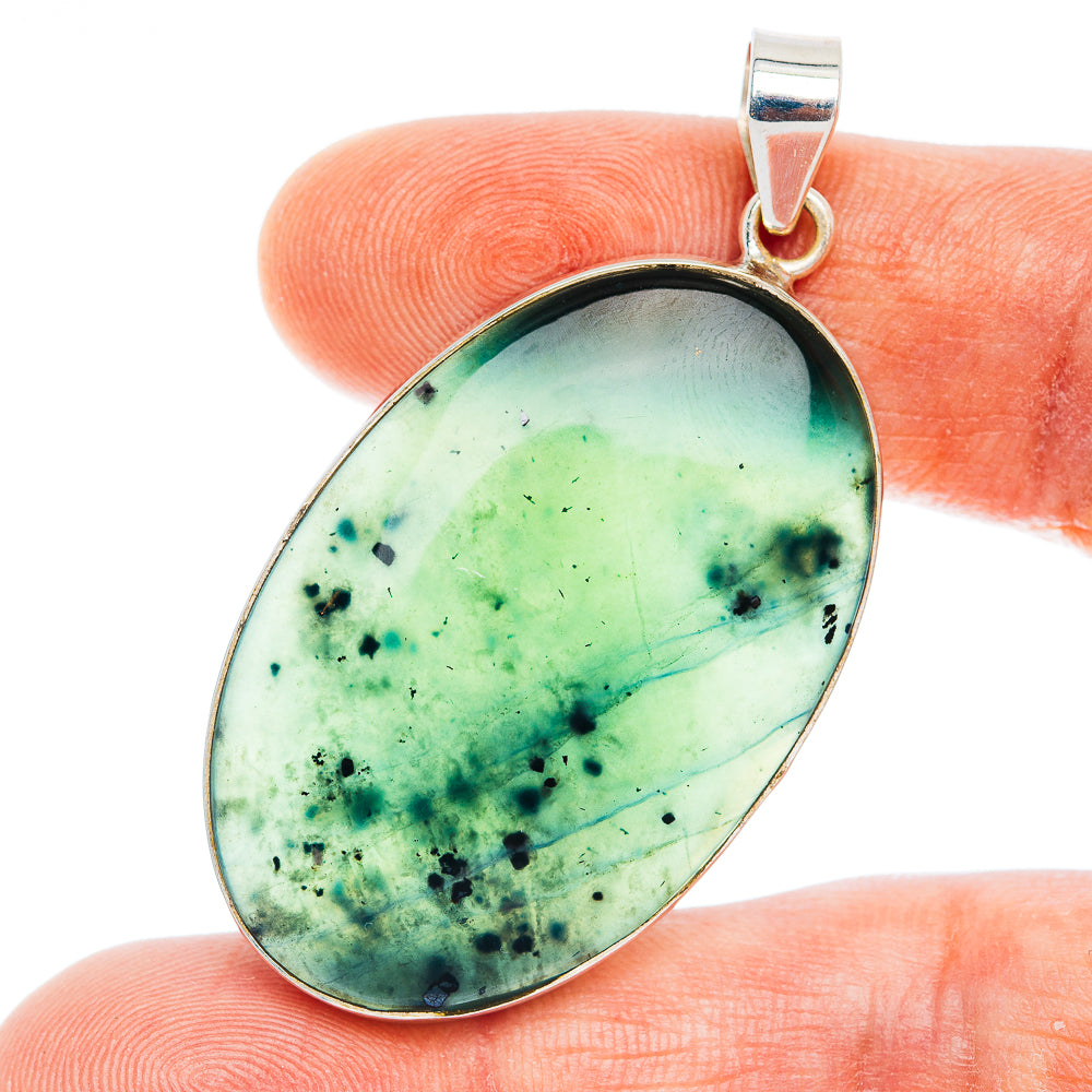 Oval green jade cabochon pendant with dark speckles, .925 sterling silver bezel