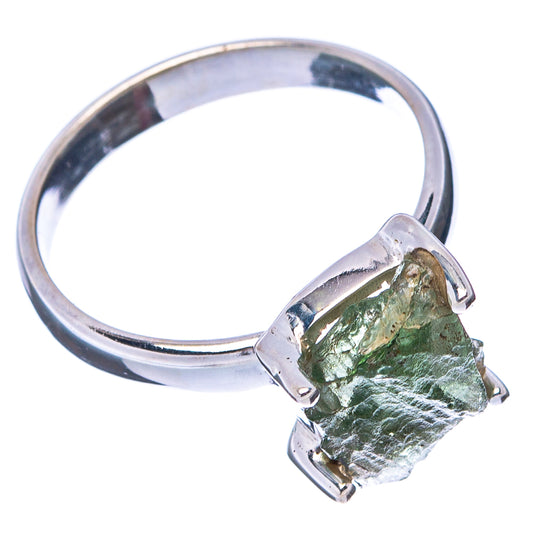 Sterling silver ring with rough green gemstone bezel and side prongs