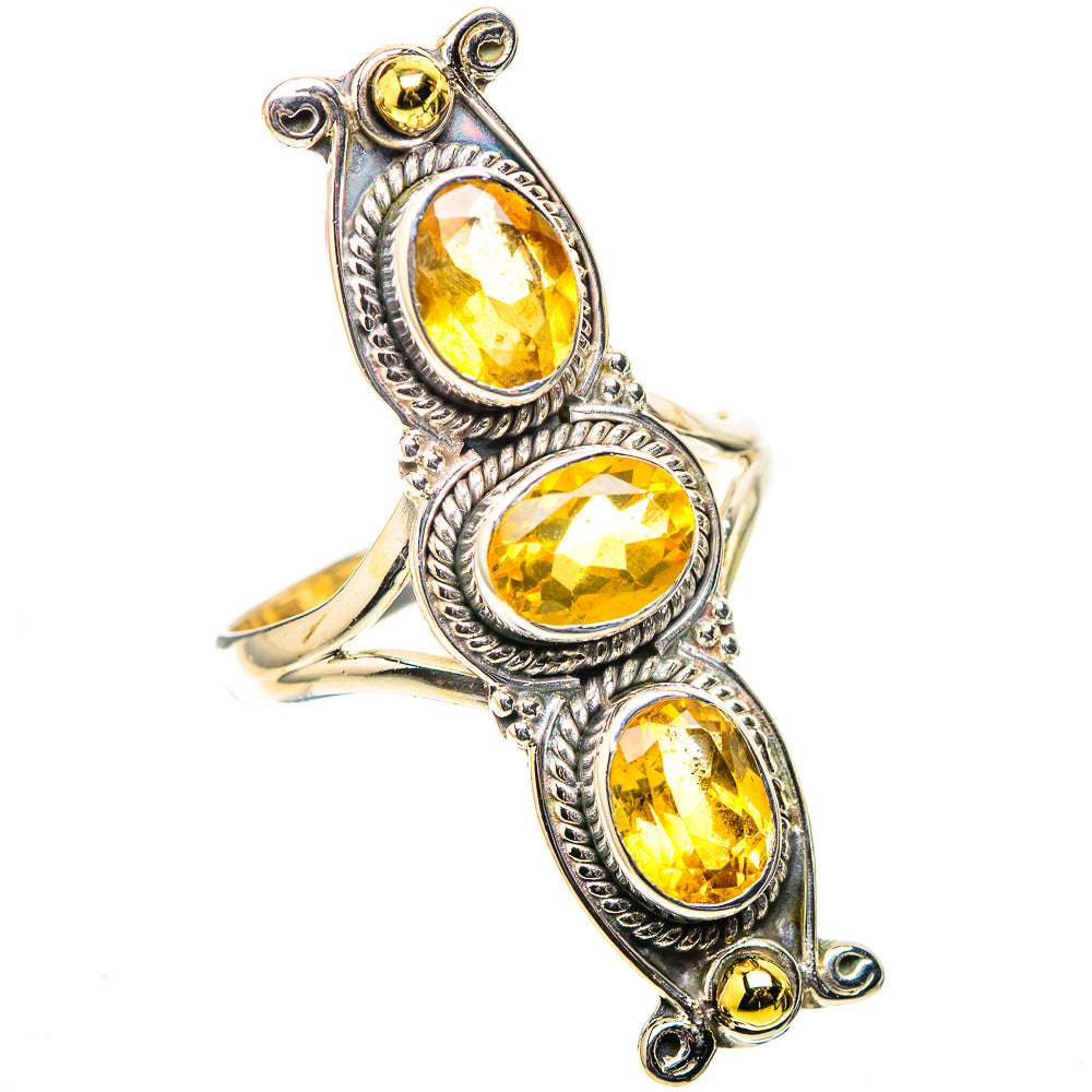 Silver statement ring with three faceted oval citrine gemstones, ornate scroll accents