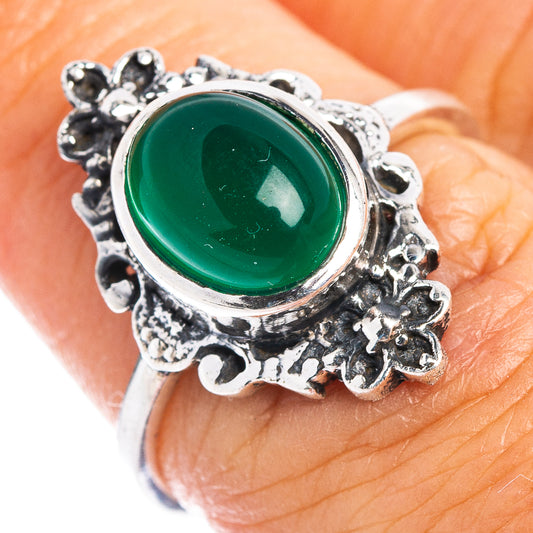 Sterling silver ring with green oval cabochon and ornate floral filigree, size 6.75