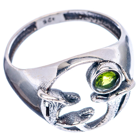 Sterling silver peridot ring with mushroom accents and bezel-set green gemstone
