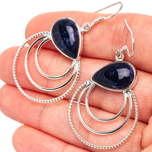 Sterling silver earrings with dark-blue oval sodalite, double hoops, and chain loop