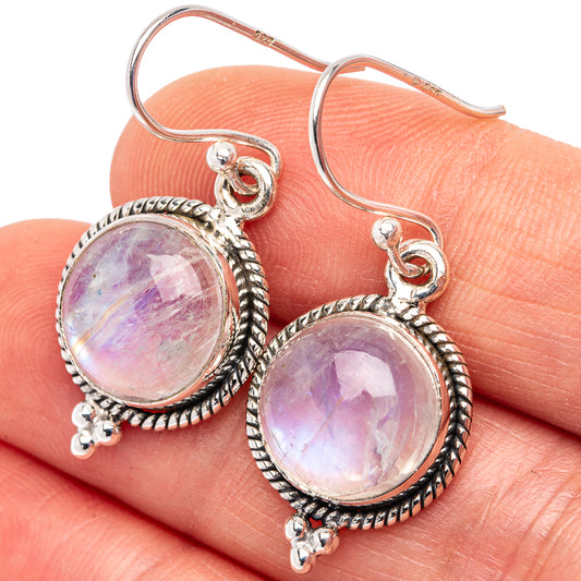 Sterling silver moonstone drop earrings with round iridescent cabochons and rope bezel