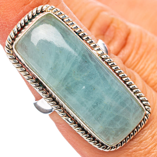 Rectangular aquamarine gemstone ring with silver rope bezel and border, size 6.