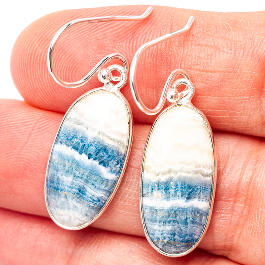 Oval scheelite drop earrings in .925 sterling silver with blue-white stone
