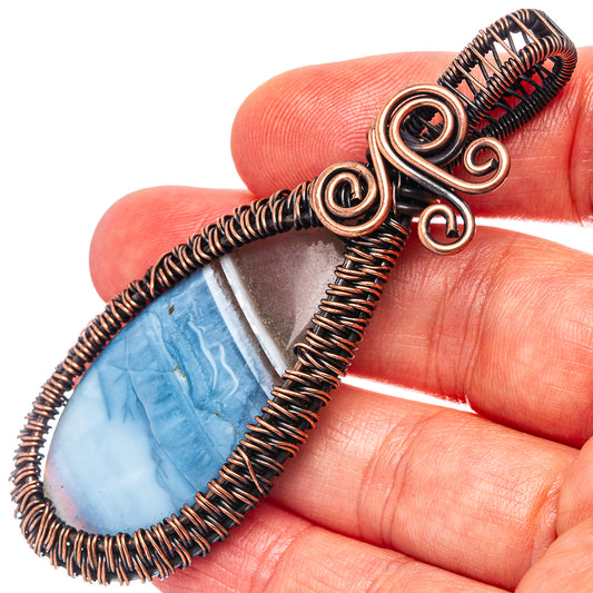 Oxidized copper wire wrap pendant, teardrop blue opal cabochon in looped coils