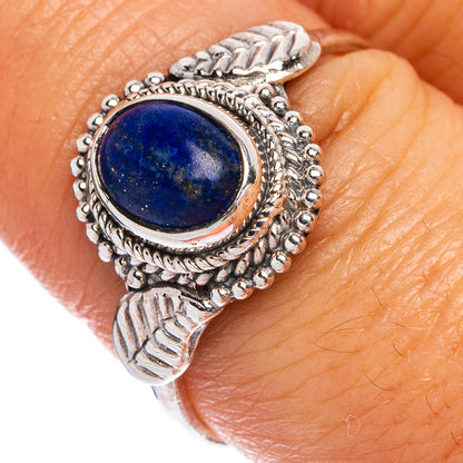 Dainty sterling silver ring with oval blue kyanite cabochon and ornate rope setting