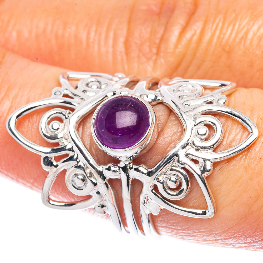 Amethyst cabochon sterling silver ring with ornate heart-like filigree setting