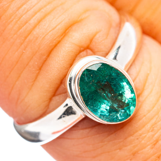 Oval green emerald gemstone ring, .925 sterling silver, finger close-up