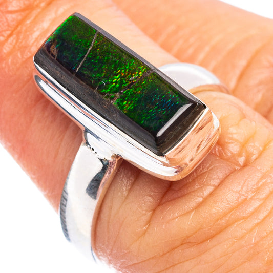 Sterling silver ring with rectangular green iridescent ammolite in bezel setting