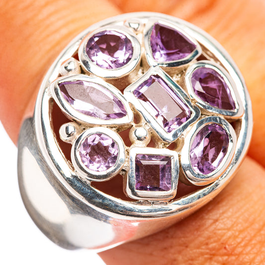 Sterling silver amethyst ring with raised purple gemstone settings, size 8.75