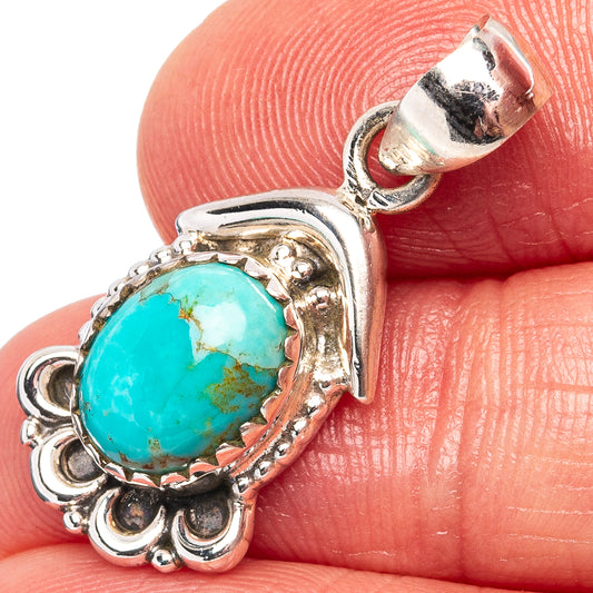 Turquoise oval pendant in ornate .925 sterling silver bezel with top bail