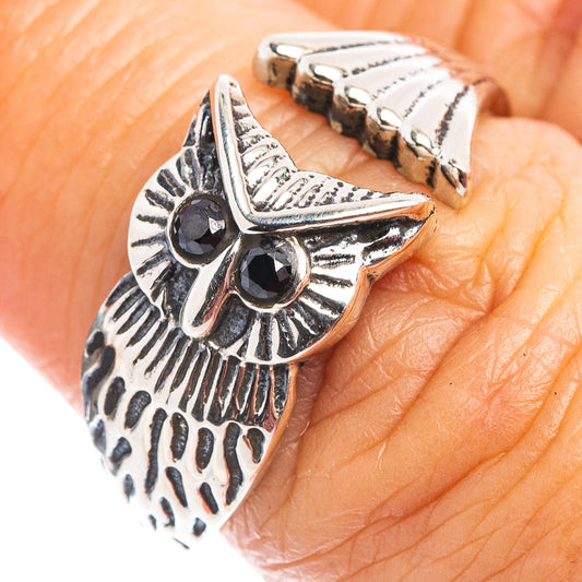 Sterling silver adjustable owl ring with dark gemstone eyes, open band detail