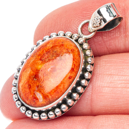 Oval orange sponge coral pendant in sterling silver, beaded halo and loop bail