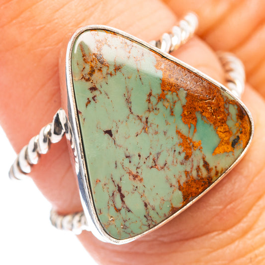 Sterling silver turquoise ring close-up with triangular stone, green-blue and rust veining