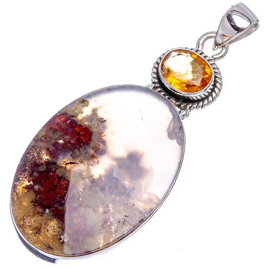 Silver-framed oval gemstone pendant with amber citrine top and red gold inclusions