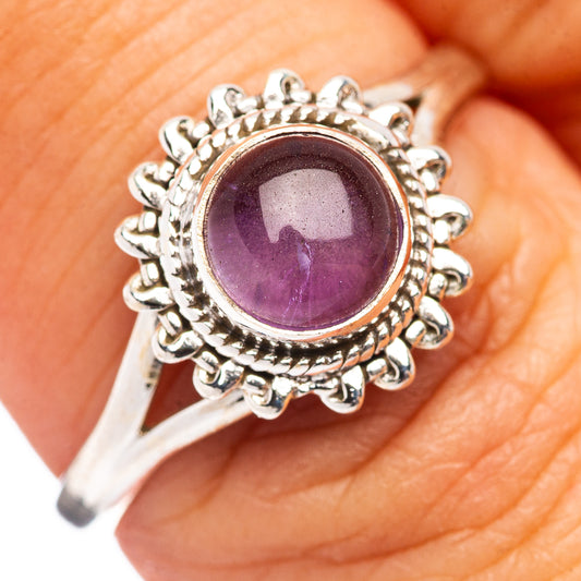 Sterling silver amethyst ring with round purple gemstone and ornate halo setting