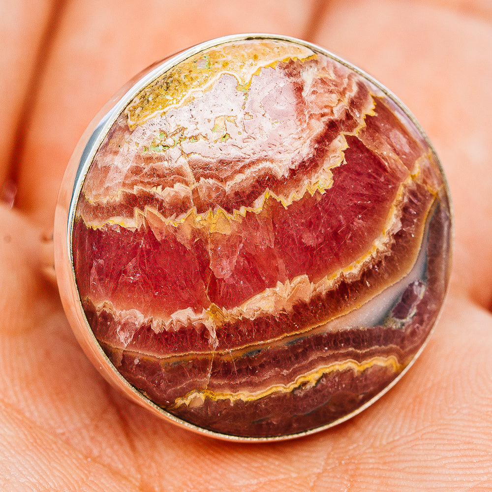 Sterling silver ring with oval rhodochrosite cabochon, deep pink red and yellow