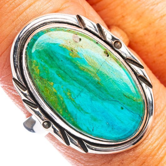 Oval turquoise opal ring in .925 sterling silver with carved bezel and side details