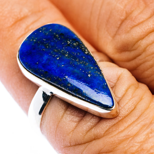 Teardrop blue gemstone ring with .925 sterling silver bezel, shown on finger