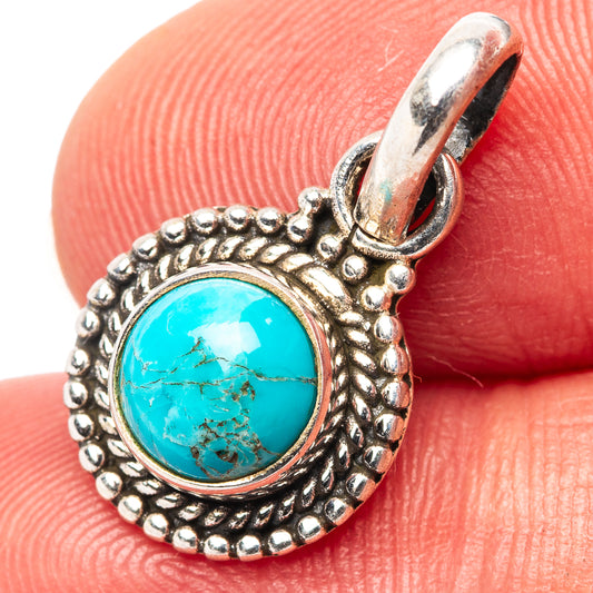 Sterling silver turquoise pendant with round cabochon and ornate beadwork setting
