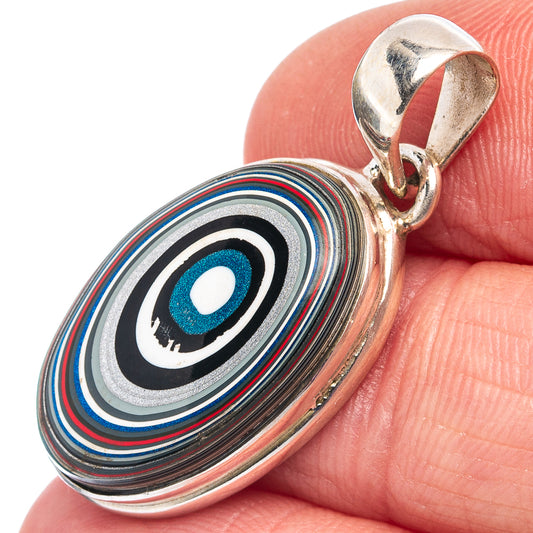 Sterling silver oval fordite pendant with concentric multicolor rings in blue, black, and red