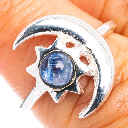 Sterling silver crescent moon and star ring with round blue kyanite cabochon on finger