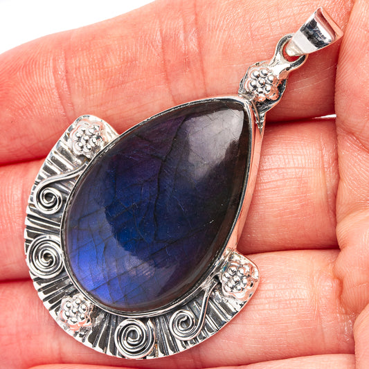 Teardrop labradorite pendant in .925 sterling silver, ornate scroll settings