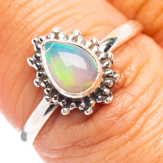 Sterling silver opal ring with oval multicolor gemstone, small beaded bezel